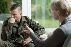 Counselor providing therapy to a veteran